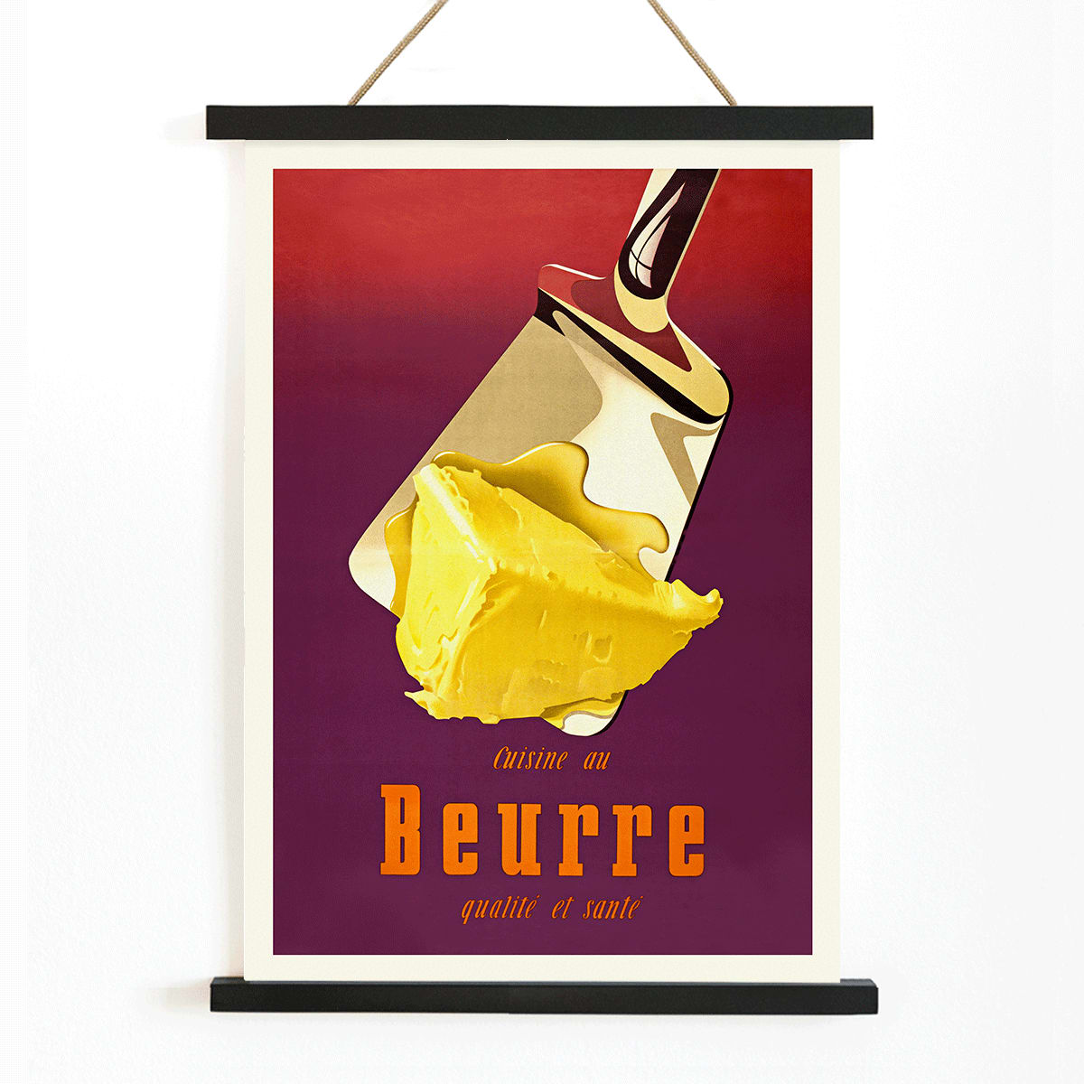 Vintage butter advertisement art by Donald Brun featuring a spatula and bold French text, with wooden magnetic frame on white background