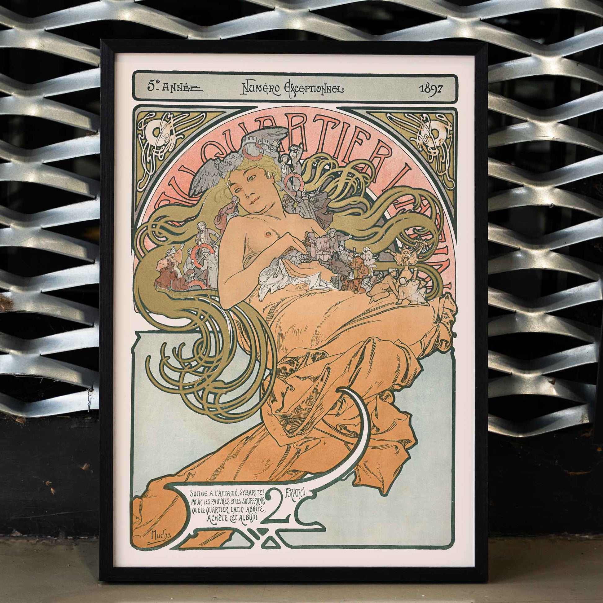 Alphonse Mucha Au Quartier Latin poster with elegant woman and flowing floral tendrils in soft peach green and cream tones, framed and displayed in home decor
