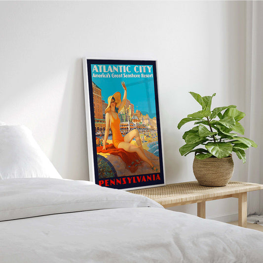 Atlantic City beach scene and Pennsylvania Railroad poster by Edward M Eggleston featuring woman in orange swimsuit at beach resort, framed and displayed in home decor