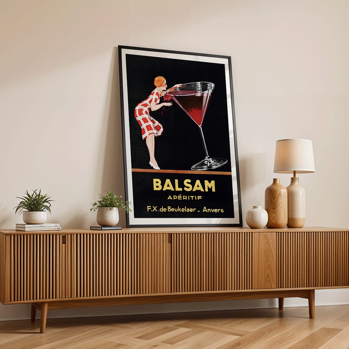 Balsam Aperitif poster by Jean d Ylen showing a woman sipping from a giant red cocktail glass vibrant vintage art, framed and displayed in home decor