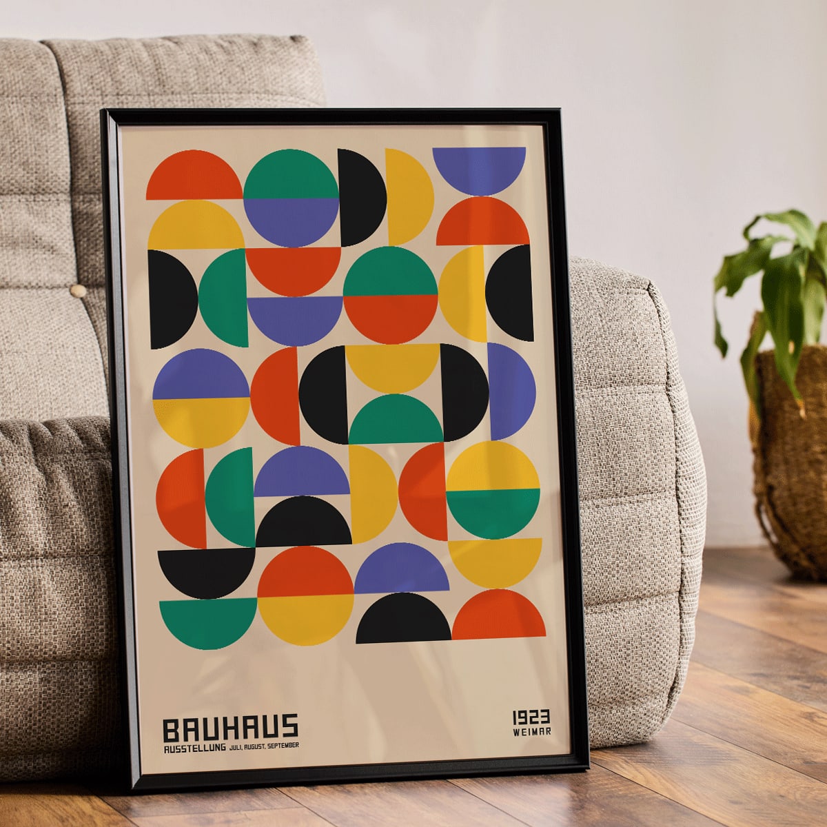 Bauhaus Poster 11 with colorful geometric shapes in a grid pattern inspired by the Weimar Exhibition artwork, framed and displayed in modern living room decor