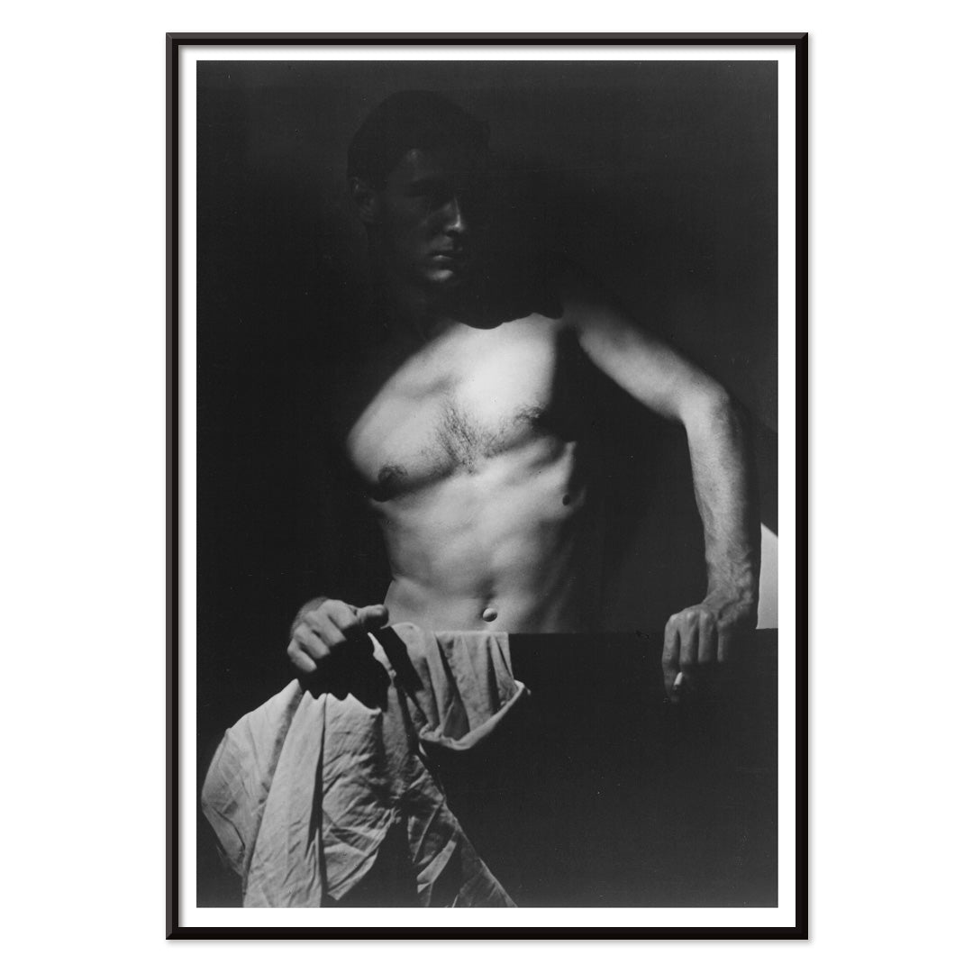 Shirtless man holding towel in dramatic lighting Max After Surfing by Olive Cotton wall art photography poster, with black aluminium frame on white background