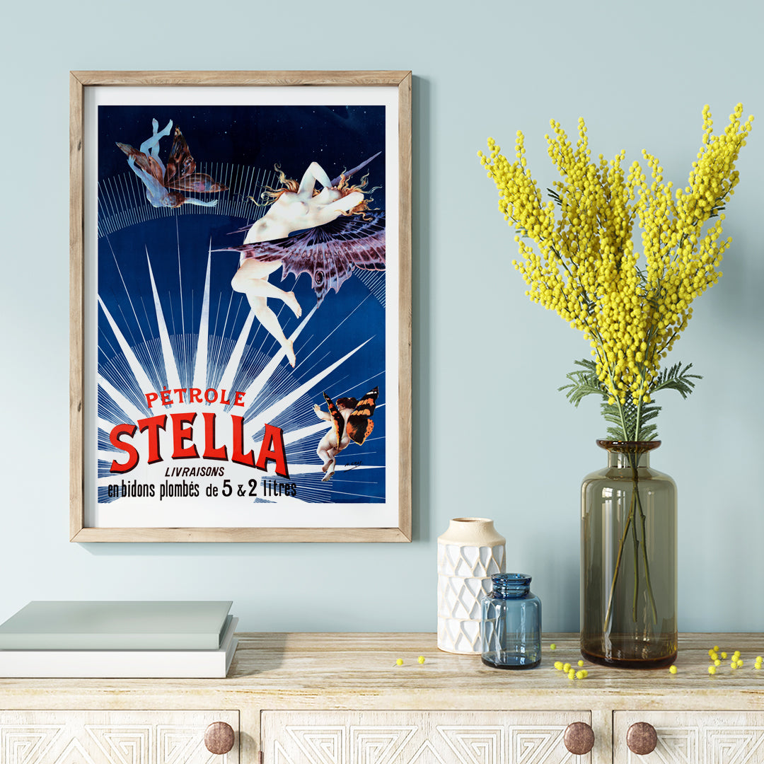 Art nouveau posters by Henri Boulanger Pétrole Stella featuring a glowing female figure with butterfly wings and a nude figure merging with butterflies against a starry sky for home decor, framed and displayed in home decor