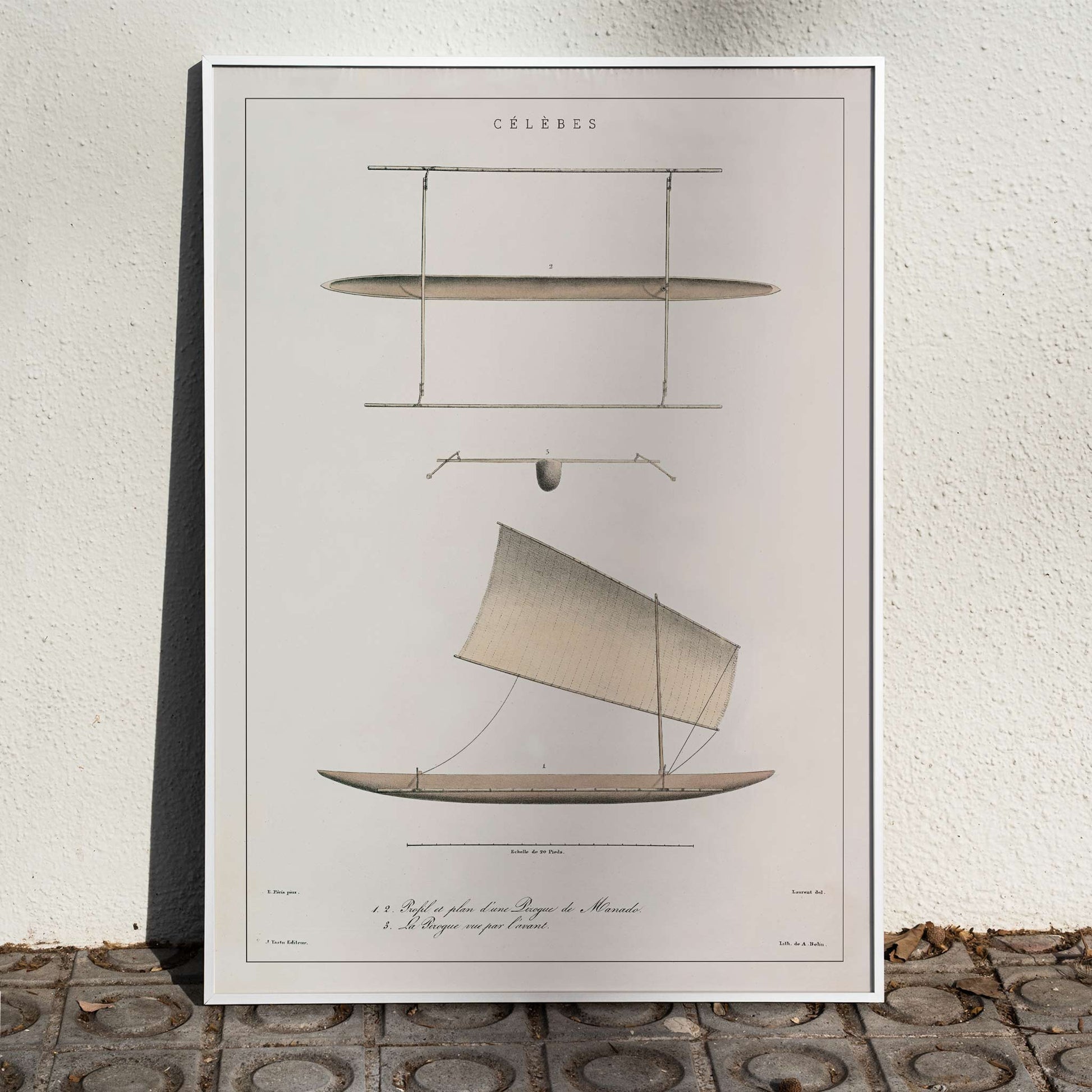 J. Tastu Celebes Canoe poster with minimalist canoe plan and side view in soft beige tones, framed and displayed in home decor