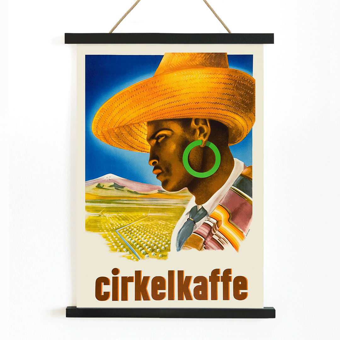 Cirkelkaffe by J Olsens poster featuring a person in a large hat with green earrings and a scenic landscape agricultural background, with wooden magnetic frame on white background
