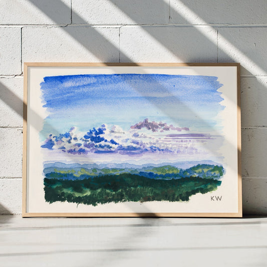 Watercolor landscape painting and abstract poster of blue sky and forest by Karl Wiener titled Naturstudie XXVII, framed and displayed in home decor