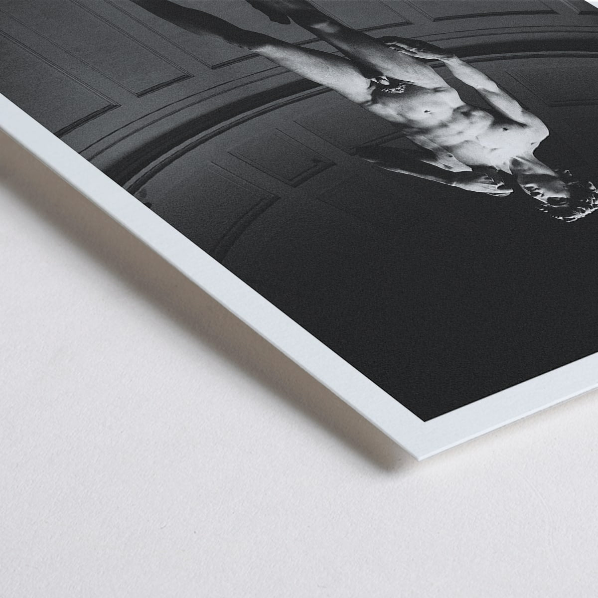 Closeup detail of Michelangelo Buonarroti David sculpture and poster at Mo Art Gallery Florence