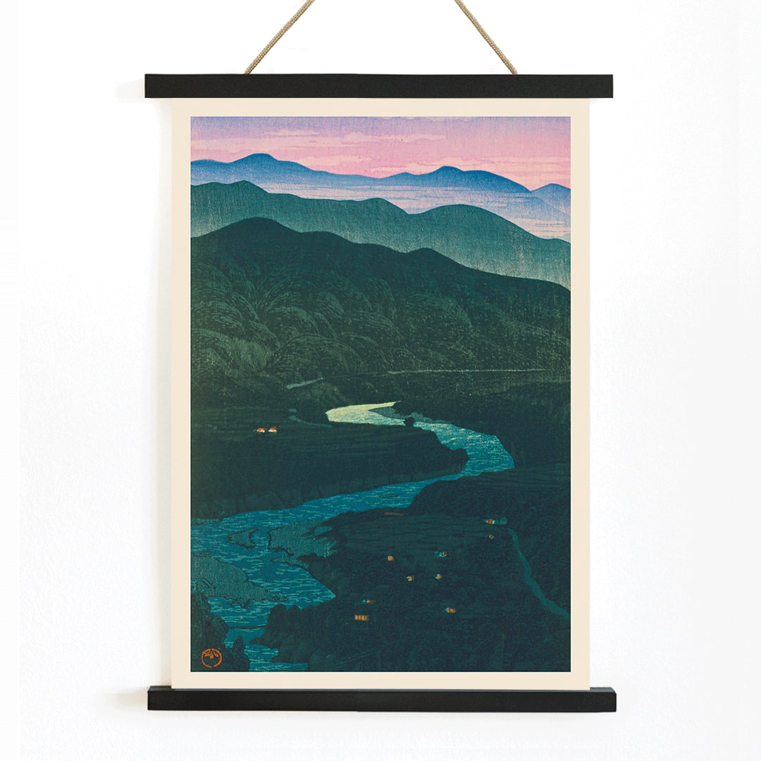 Ecchu Umidani Pass by Kawase Hasui landscape artwork showing mountains and a winding river at dawn and dusk, with wooden magnetic frame on white background