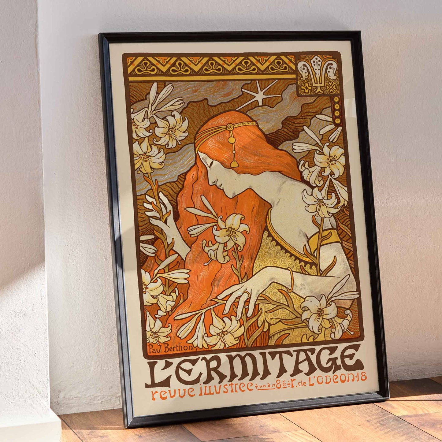 Paul Berthon LErmitage poster with red-haired woman, lilies and floral Art Nouveau ornament, framed and displayed in modern living room decor