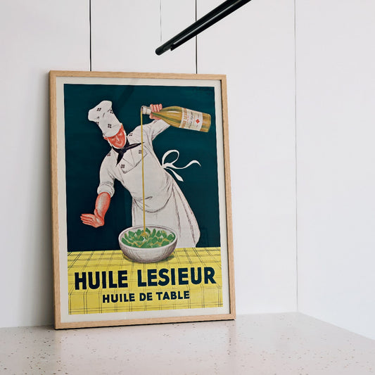 Chef pouring oil into salad Huile Lesieur poster by Leonetto Cappiello, framed and displayed in home decor