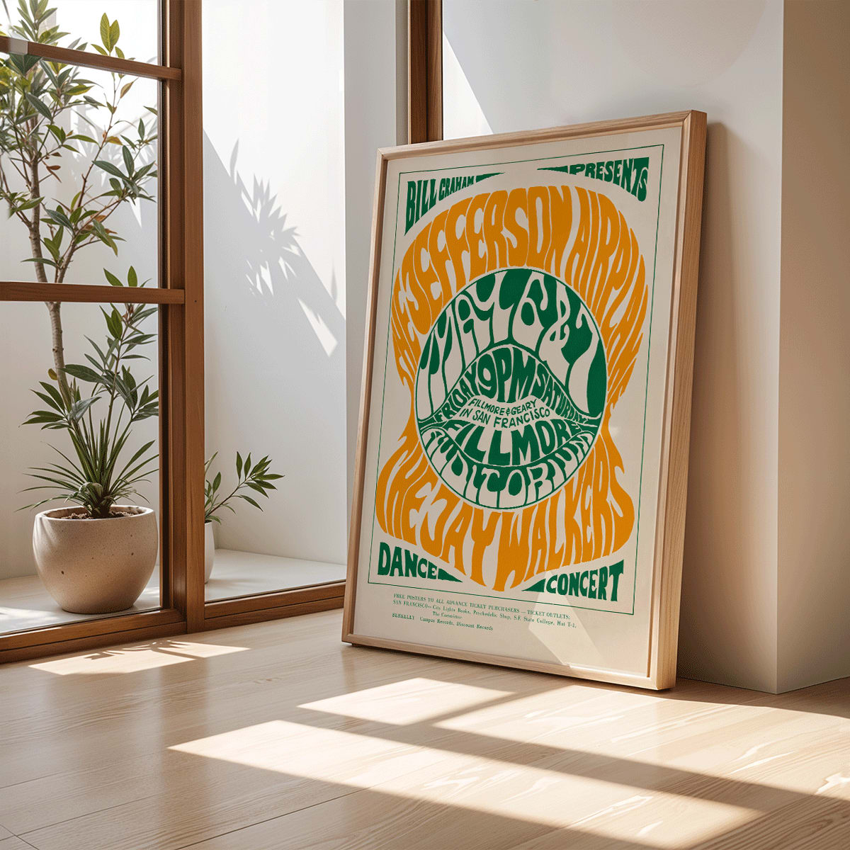 Psychedelic concert poster by Wes Wilson for The Jefferson Airplane and Jay Walkers at Fillmore Auditorium with vibrant orange and green text, framed and displayed in home decor