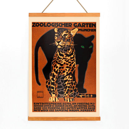 Leopard and black panther poster for Zoologischer Garten München by Ludwig Hohlwein featuring bold text artwork, with wooden magnetic frame on white background
