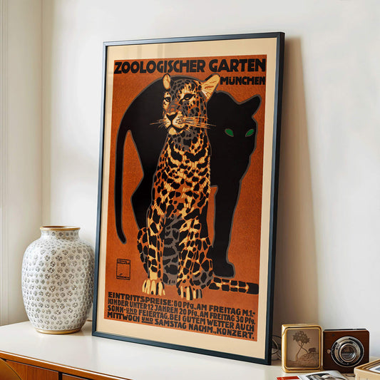 Leopard and black panther poster for Zoologischer Garten München by Ludwig Hohlwein featuring bold text artwork, framed and displayed in home decor