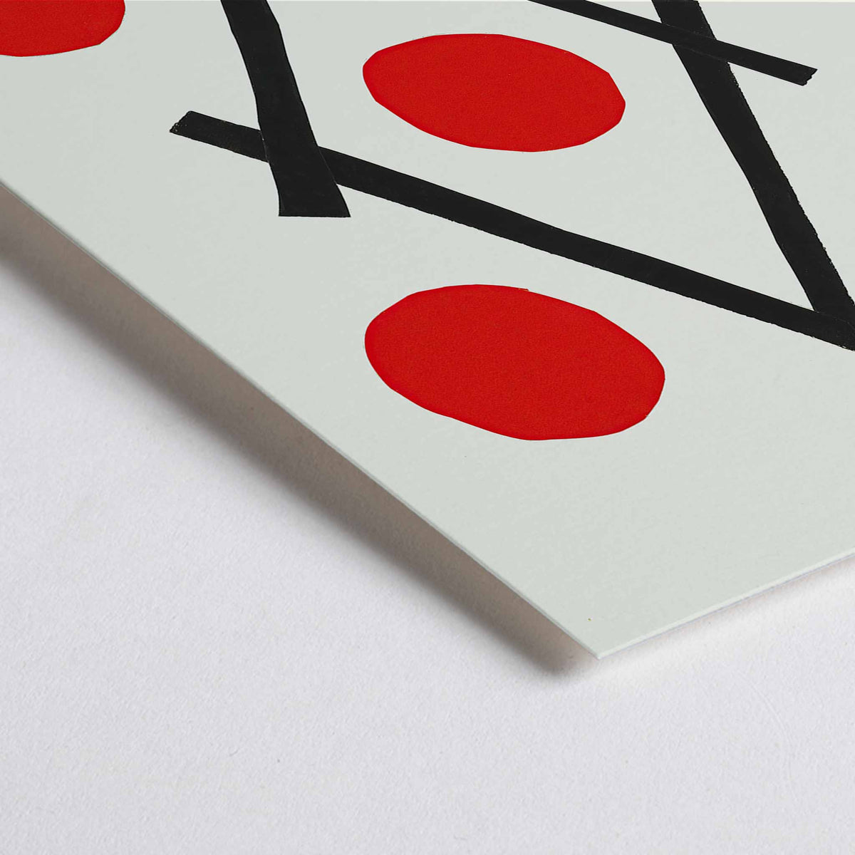Closeup detail of Henri Matisse Losange poster with five red circles around intersecting black lines forming a diamond on white ground