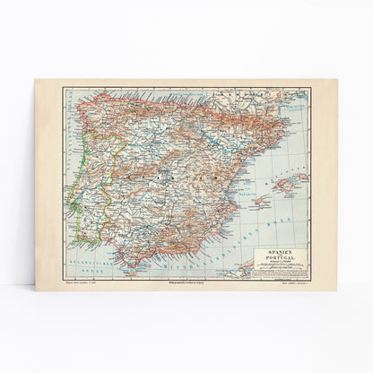 Ancient vintage map of Spain and Portugal with detailed regions and borders by Bibliographic institute of Liepzig poster artwork, framed and displayed in modern living room decor