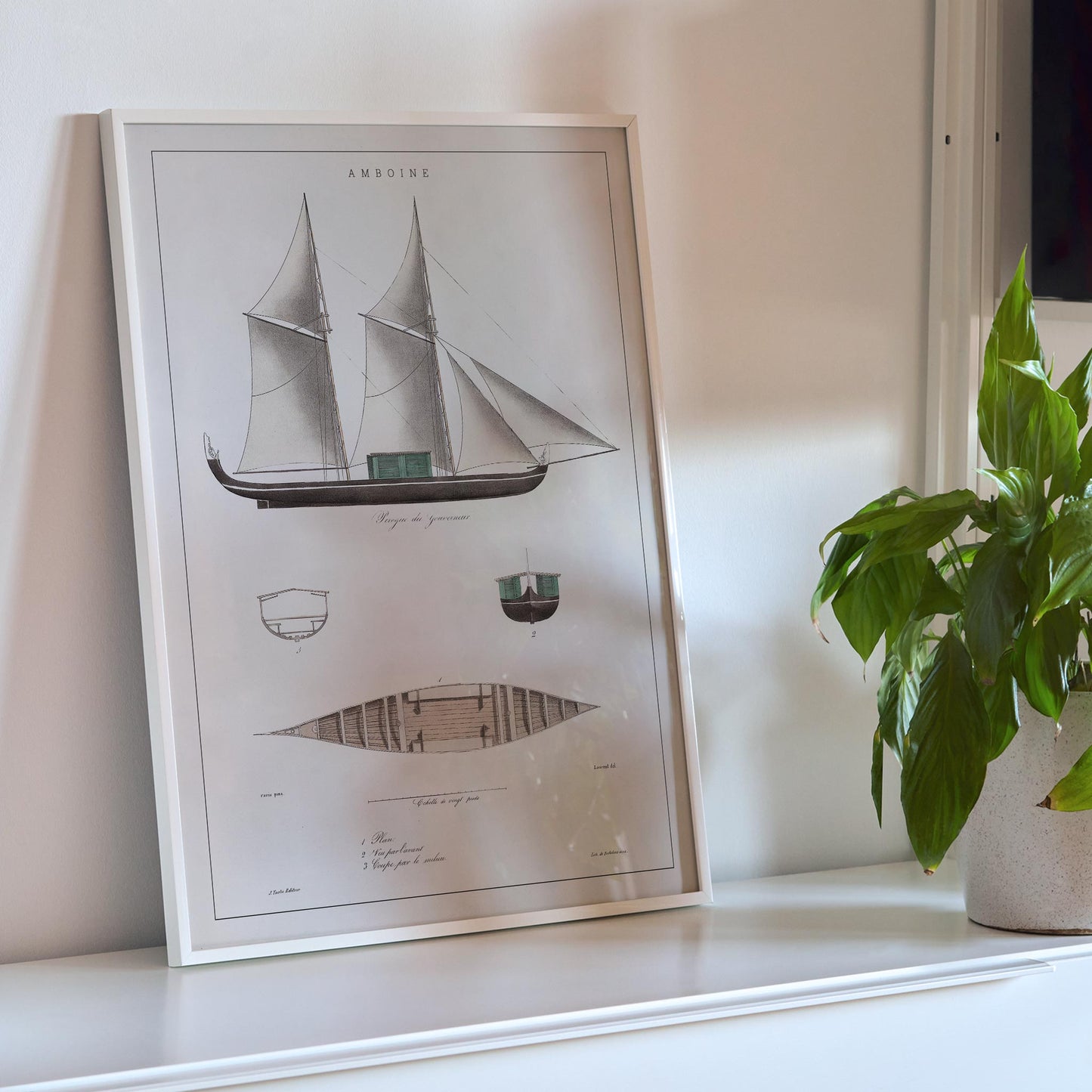 Amboine by J Tastu minimalist sailing ship poster with detailed hull and sail diagrams in soft beige tones, framed and displayed in modern living room decor