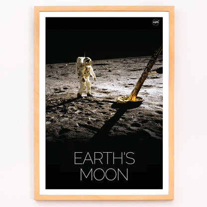 Astronaut on the lunar surface with text Earths Moon Man on Moon 2 by NASA poster, framed and displayed in modern living room decor