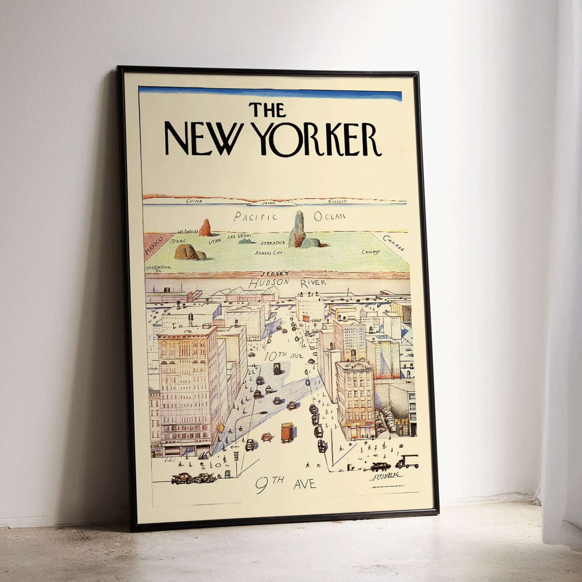 The New Yorker poster by Saul Steinberg featuring a whimsical stylized cityscape and landscape with 9th and 10th Avenue, framed and displayed in home decor