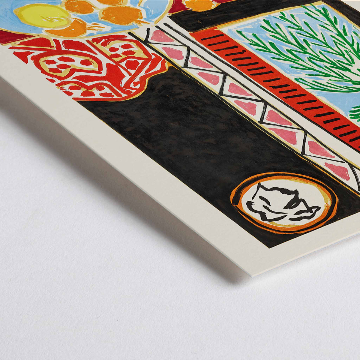 Closeup detail of Henri Matisse Nice Travail et Joie poster with palm fronds, fruit on a blue plate, and bold red and black shapes