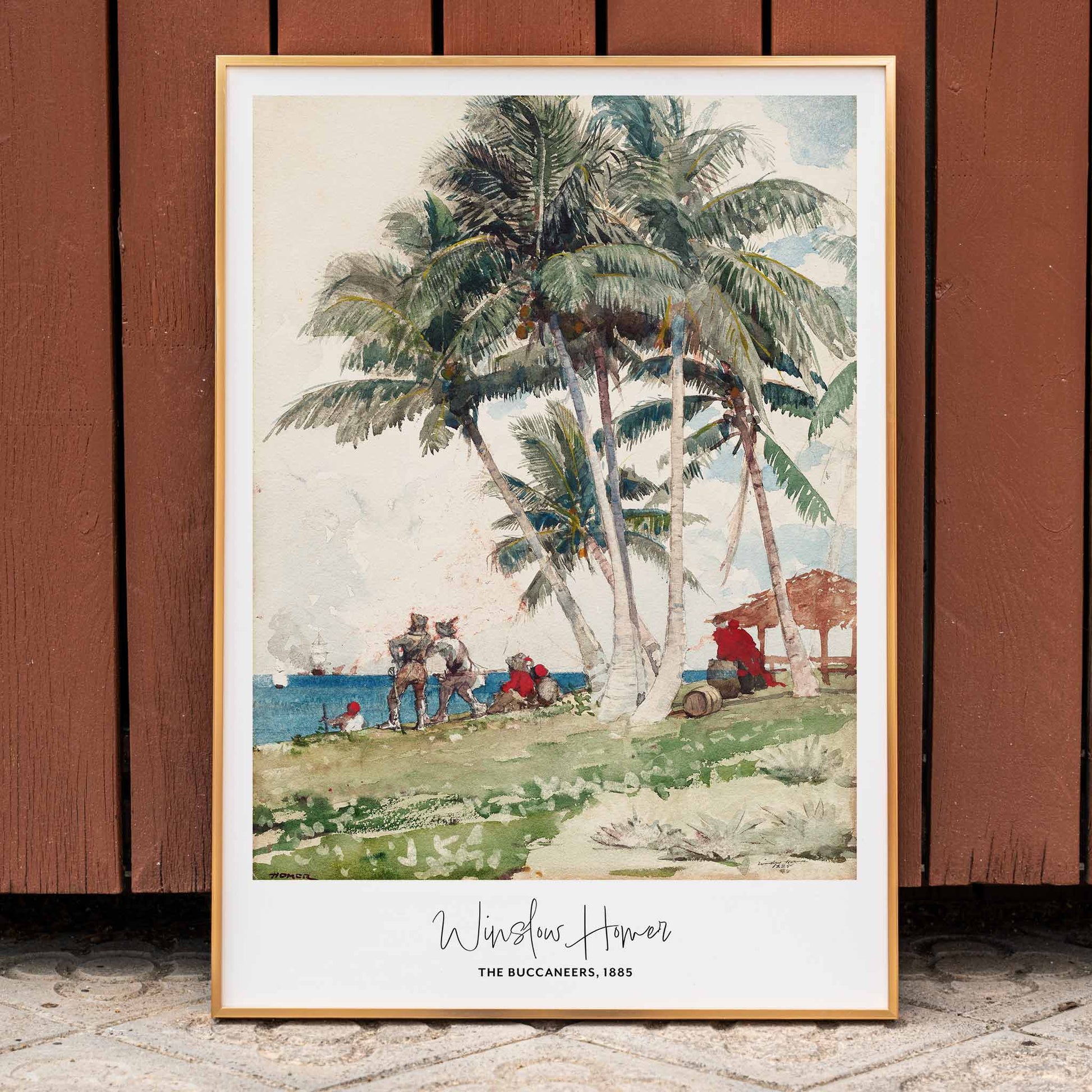 The Buccaneers by Winslow Homer poster featuring pirates under palm trees on a tropical beach with a ship in the background, framed and displayed in home decor
