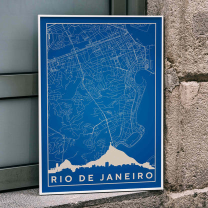 Minimalist blue and white Rio de Janeiro map poster by Moryarty featuring detailed street lines and city skyline silhouette, framed and displayed in home decor