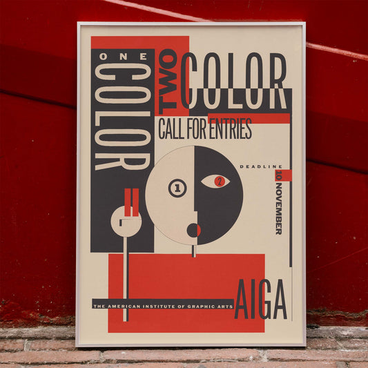 AIGA poster by Michael Mabry titled One color two color call for entry featuring bold geometric design and typography, framed and displayed in home decor