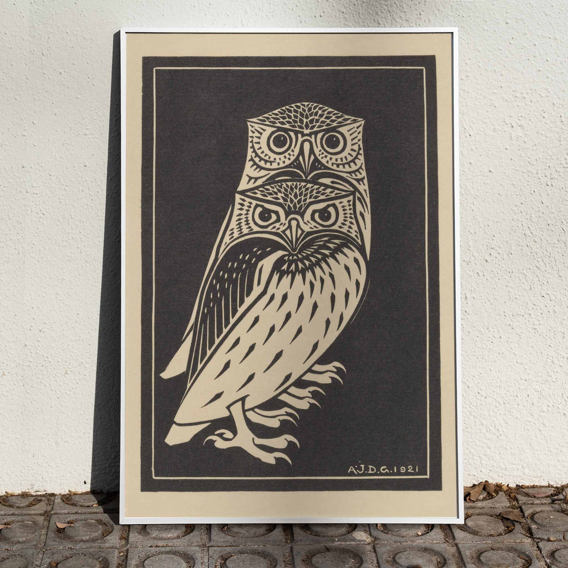 Stylized black and white owls artwork by Julie de Graag titled Two black and white owls illustration and poster, framed and displayed in home decor