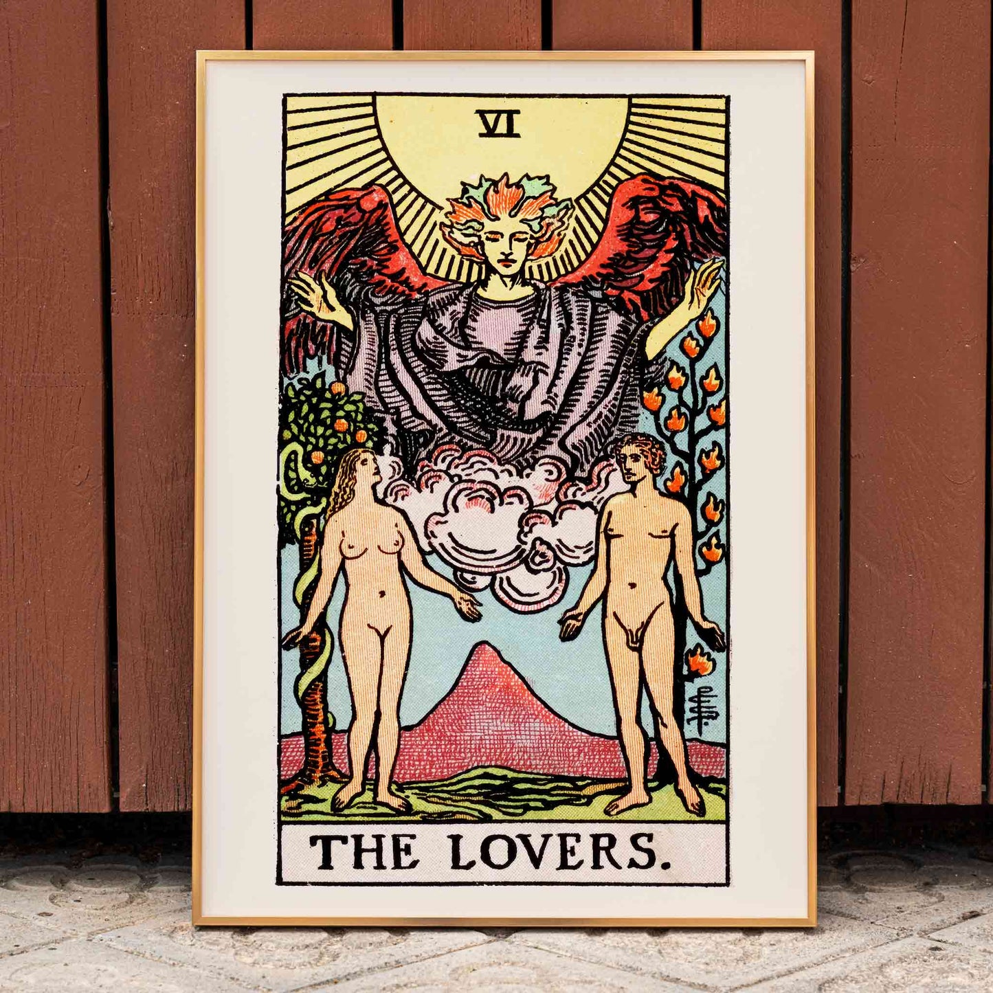 The Lovers Tarot card by Rider Waite featuring a winged angel above a man and woman in a garden illustration and poster, framed and displayed in home decor