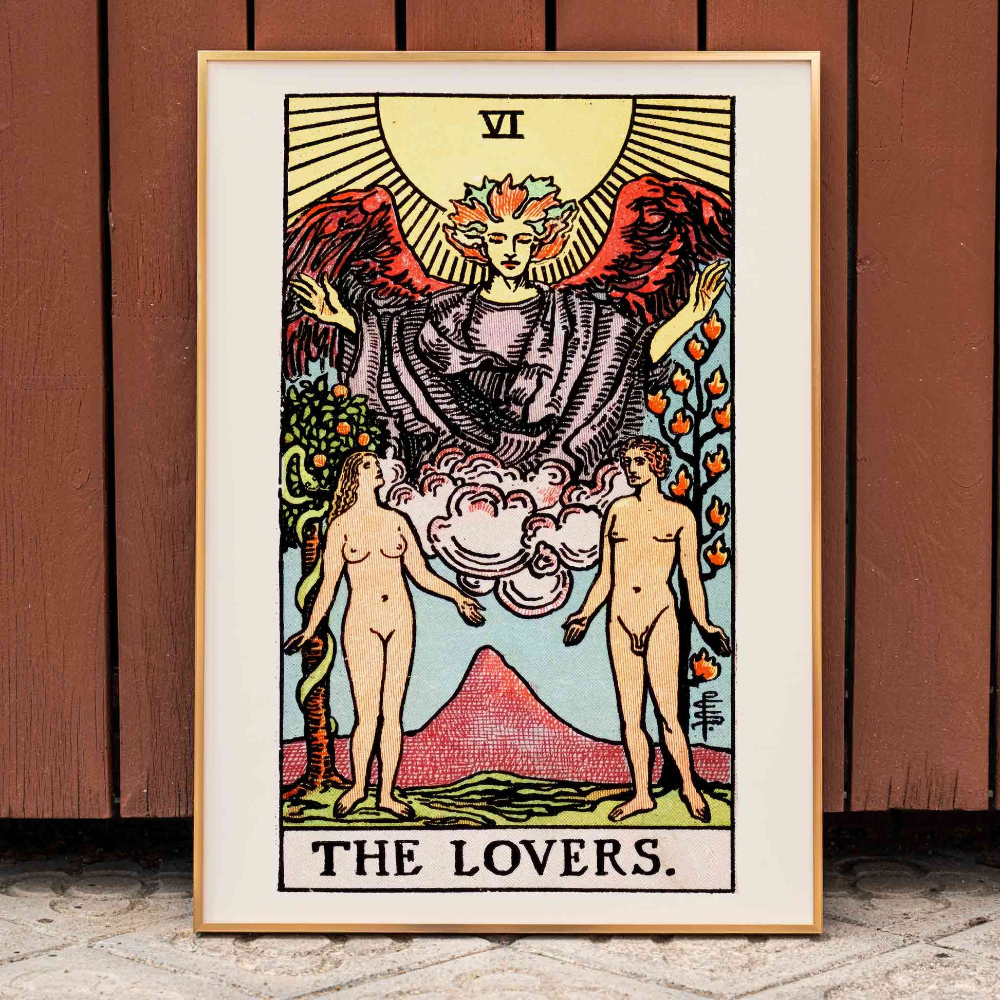 The Lovers Tarot card by Rider Waite featuring a winged angel above a man and woman in a garden illustration and poster, framed and displayed in home decor
