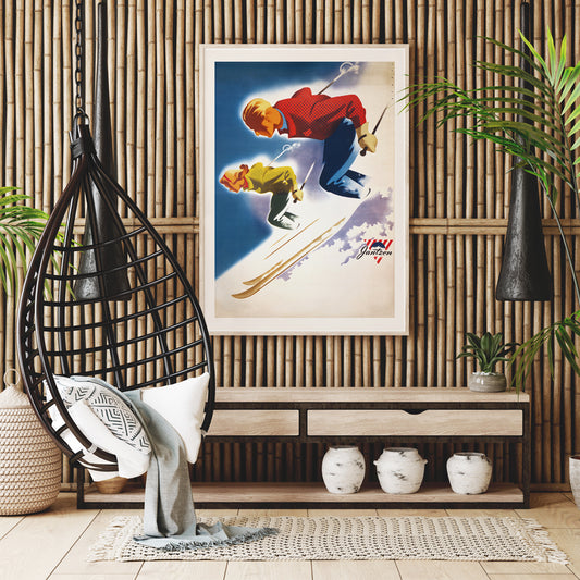 Vintage skiing poster of man and woman skiing downhill in bold colors by Joseph Binder for Jantzen, framed and displayed in home decor