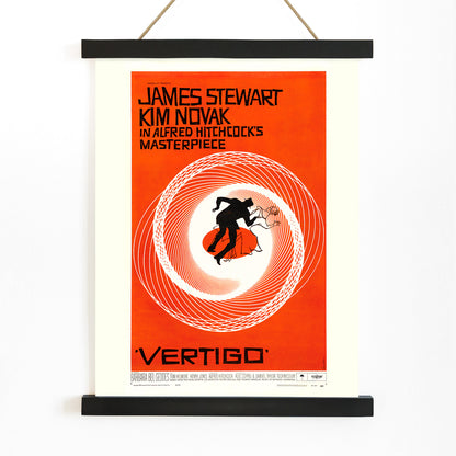 Vertigo movie poster by Saul Bass featuring vibrant orange background swirling spiral and silhouetted figures graphic design, with wooden magnetic frame on white background