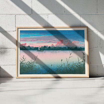 Early Autumn in Urayasu by Kawase Hasui peaceful lakeside village poster with serene waterfront houses boat and colorful sky, framed and displayed in modern living room decor